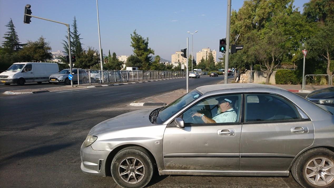 Traffic inspector stopped on the crosswalk