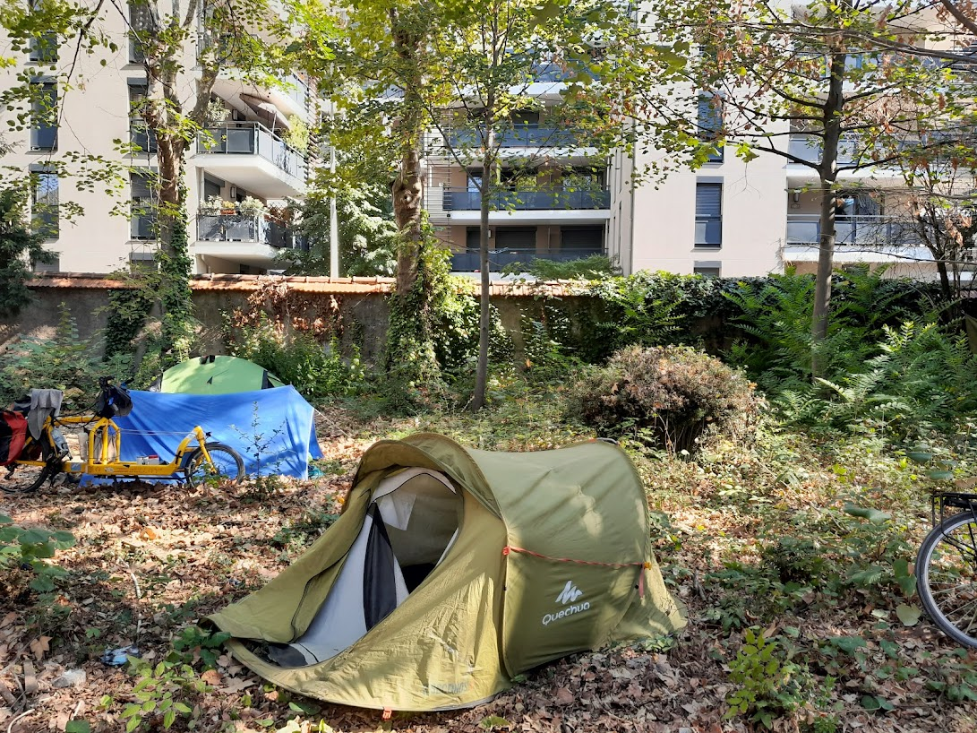 the yellow bike has a platform so large that a dog sleeps their while
the owner bikes