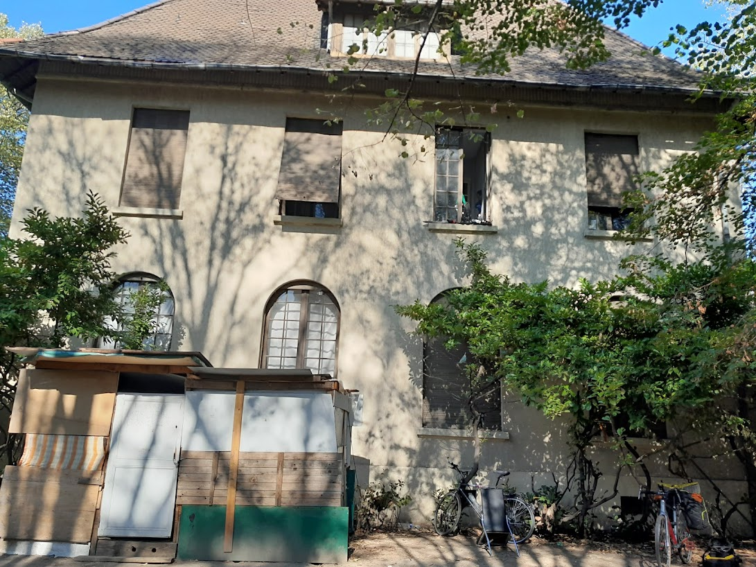 the shack outside is a barber shop run by a few of the residents